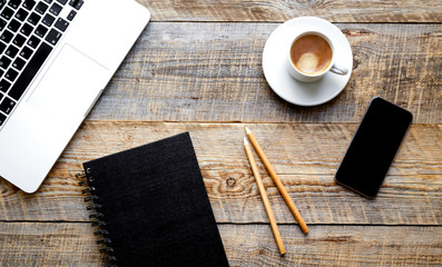 Working place with laptop on wooden table
