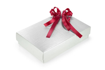 Gold gift box with red ribbon isolated on white 