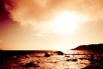 Fototapeta premium Sunset Over Rocky Beach