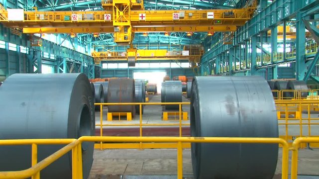 Transporter moves big roll of aluminum at metallurgical plant HDV to HD