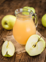 Apple Juice on vintage wooden background