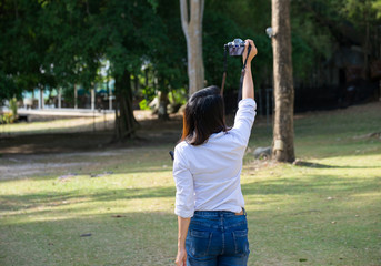 Woman take a photo in nature