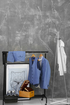 Casual stylish suit for groom on hanger stand indoors