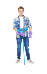 Young service man holding floor brush on white background