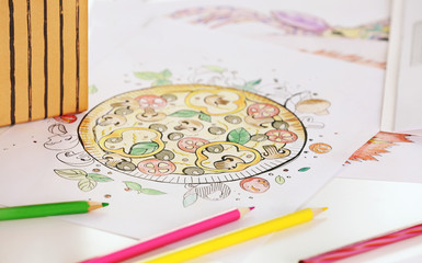 Coloring pictures for adults on table