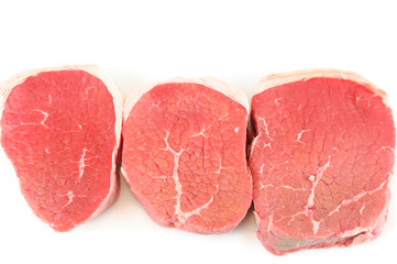 fresh chopped pork tenderloin isolated on white background