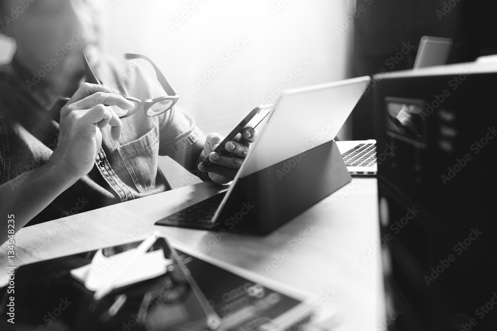 Poster website designer working digital tablet and computer laptop with