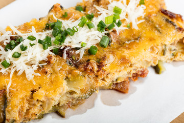 Vegetables casserole with cheese and chives