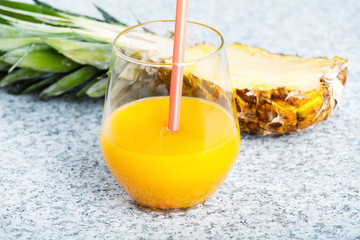 Fresh pineapple and glass with pineapple juice
