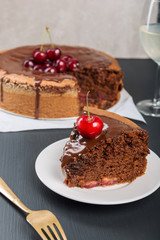 Chocolate cake with juicy cherries
