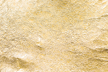 Gold wrinkled paper texture abstract background