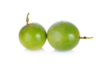 whole passion fruit with stem on white background