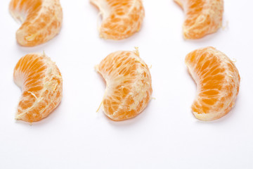 Peeled mandarin isolated on white background.