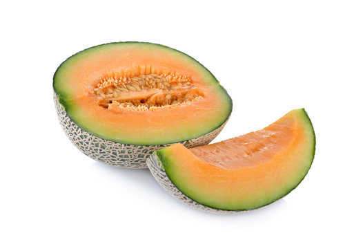 half and portion cut ripe cantaloupe on a white background