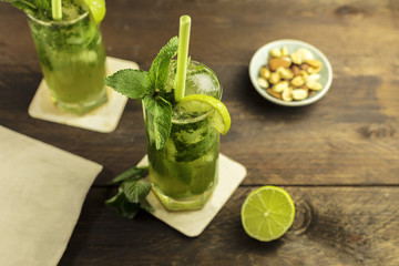 Mojito cocktail with mint leaves and lime