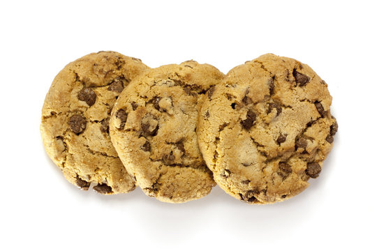 Three crunchy chocolate chips cookies on white