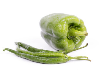 Fresh green peppers on white background.