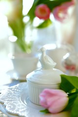  Place setting with pink tulips at the background