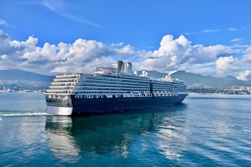 Cruise ship taking off Vancouver port to Alaska.  Coal Harbor. Indian Arm. Vancouver. British Columbia. Canada. 