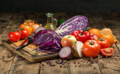 Set of fresh vegetables and fruits on wooden table