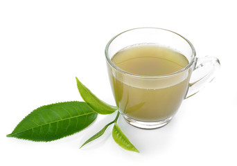 Cup with green tea and green leaves.