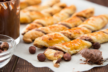 homemade cakes - puff pastry with chocolate paste. twisted cakes