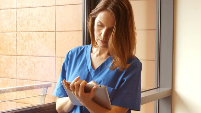 Nurse using digital tablet in hospital 4k