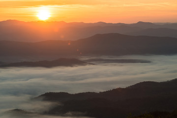 The beautiful landscape of the sea mist cover the highland mountains during the sunrise in northern region of Thailand.