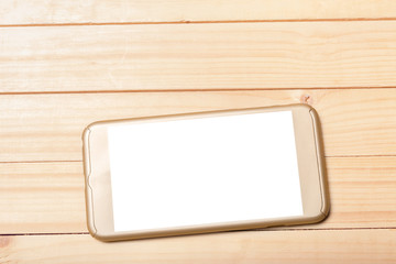 Smart phone on wooden background