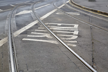 Tram Tracks and Arrow Sign on Street in Nottingham