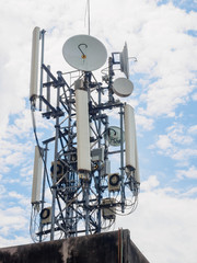 Abtrack of the cellular tower with blue sky background.