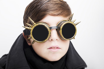 Portrait of a handsome boy closeup steampunk on white background