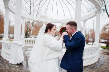 Sensual wedding couple background white arch with columns at col