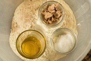 Prep Bowls of Ingredients on Flour in Mixing Bowl