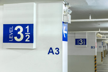 A car parking sign, floor level 3 in parking garage interior, ne