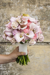 Wedding bouquet with carnations and pink calla flowers