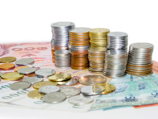 Stack of coins on banknotes money background