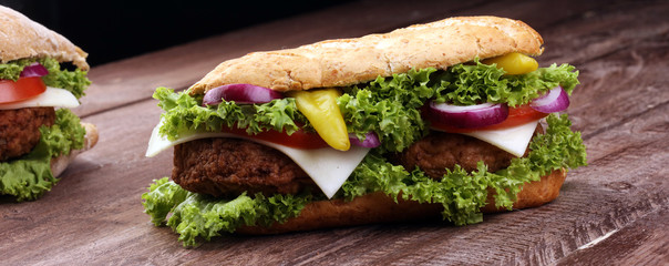 Tasty grilled prawn and beef burger with lettuce and tomato