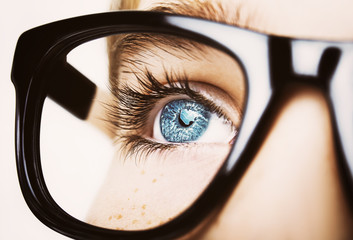 Portrait of a boy wearing glasses close