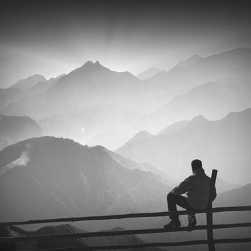 Hiker and morning fog. Black and white