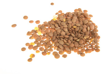 Heap of lentils seen from the side isolated on a white background