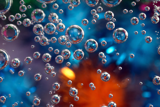 Macro bubbles of water on colorful background