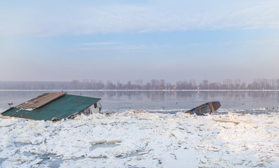 Two water objects trapped on frozen river Danube