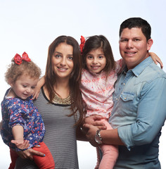 Family of four smiling