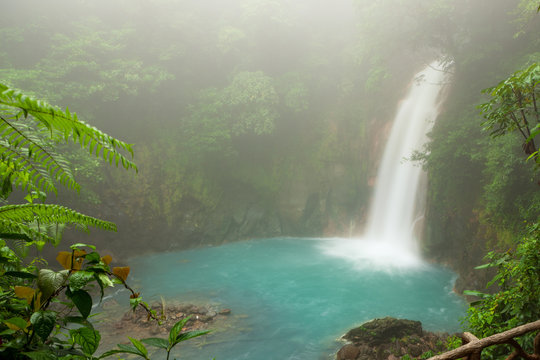 Rio celeste waterfall at foggy day