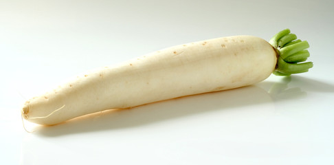 daikon radishes on white background