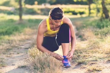Fototapeta premium Sportswoman Tying Shoelaces