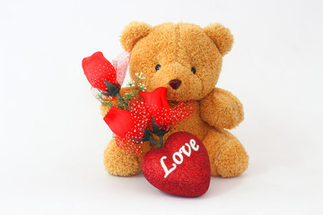 Brown teddy bears and red roses on a white background.