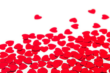 Valentines day border of red hearts confetti with copy space on white background. Festive Valentine.