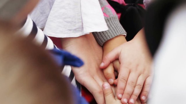 Stacked hands of children